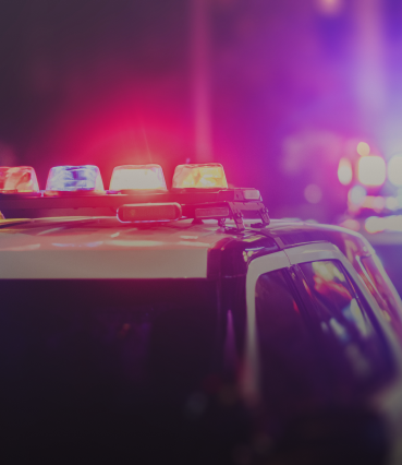 a police cars lights at nighttime